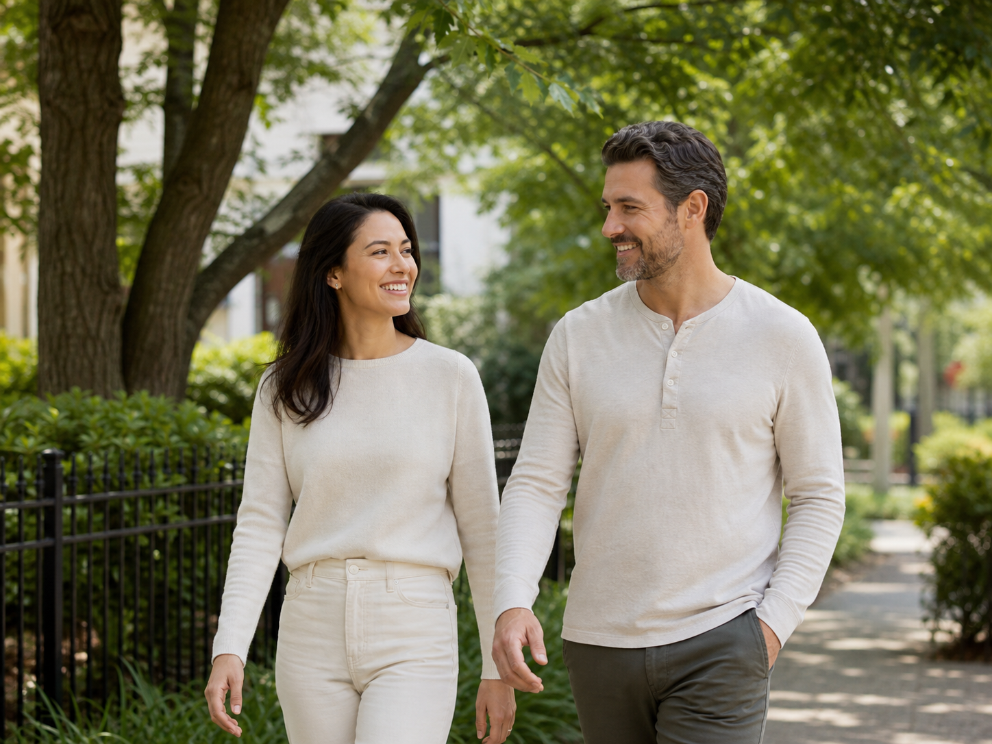 Two people walking outdoors and smiling after a meal.
